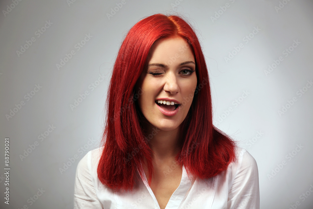 Beautiful young woman on gray background Beautiful young woman on gray background