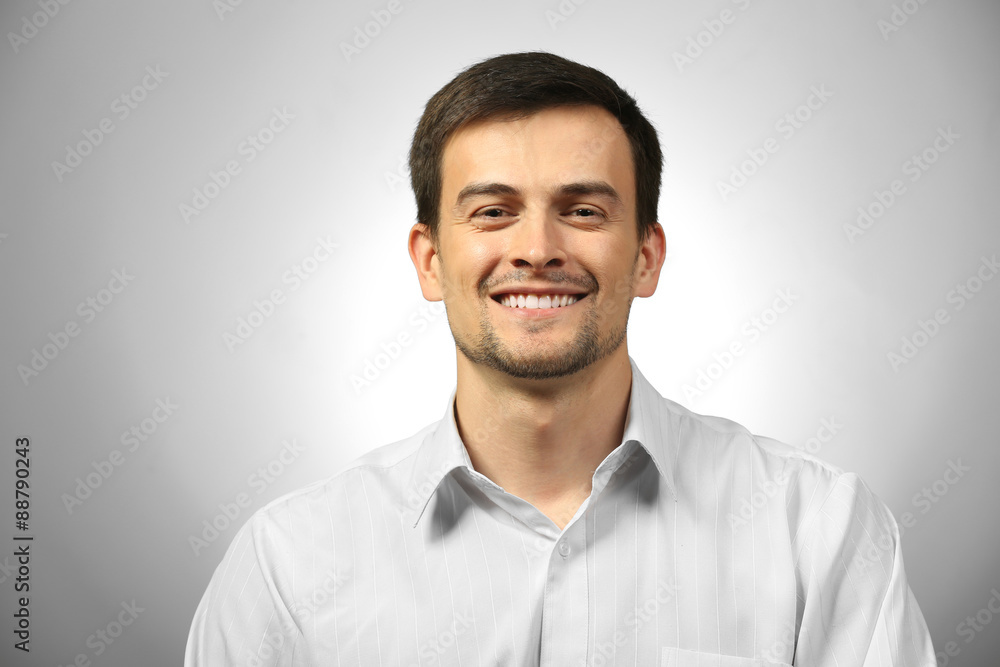 Handsome young man on gray background Handsome young man on gray background