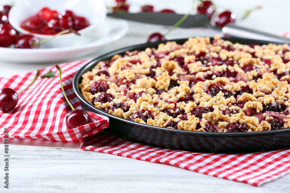 Tasty homemade pie with cherries on table close up Tasty homemade pie with cherries on table close up