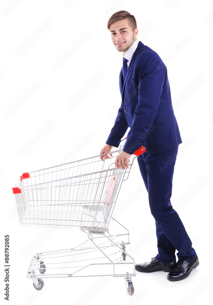 Young man with empty shopping cart, isolated on white Young man with empty shopping cart, isolated on white