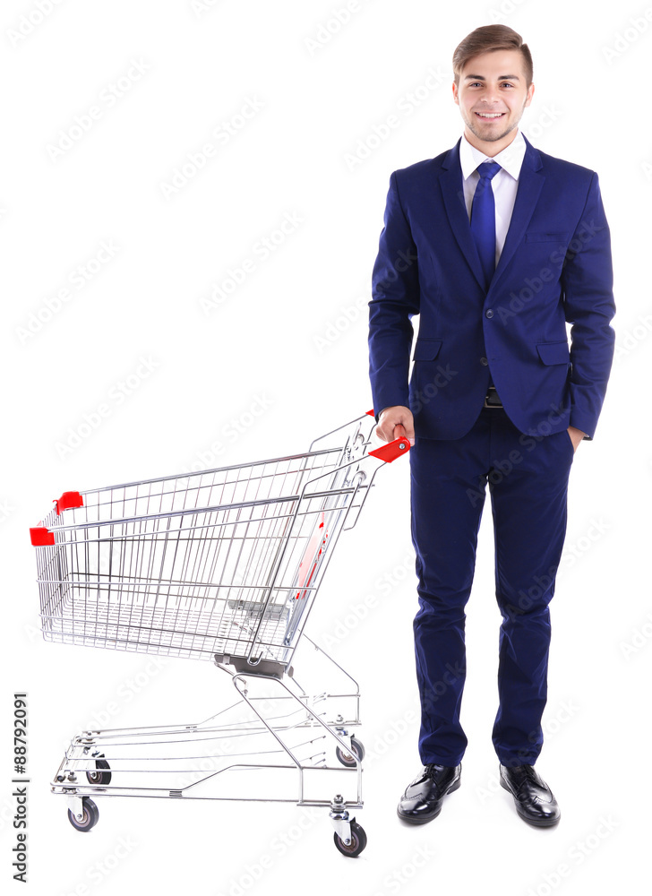 Young man with empty shopping cart, isolated on white Young man with empty shopping cart, isolated on white
