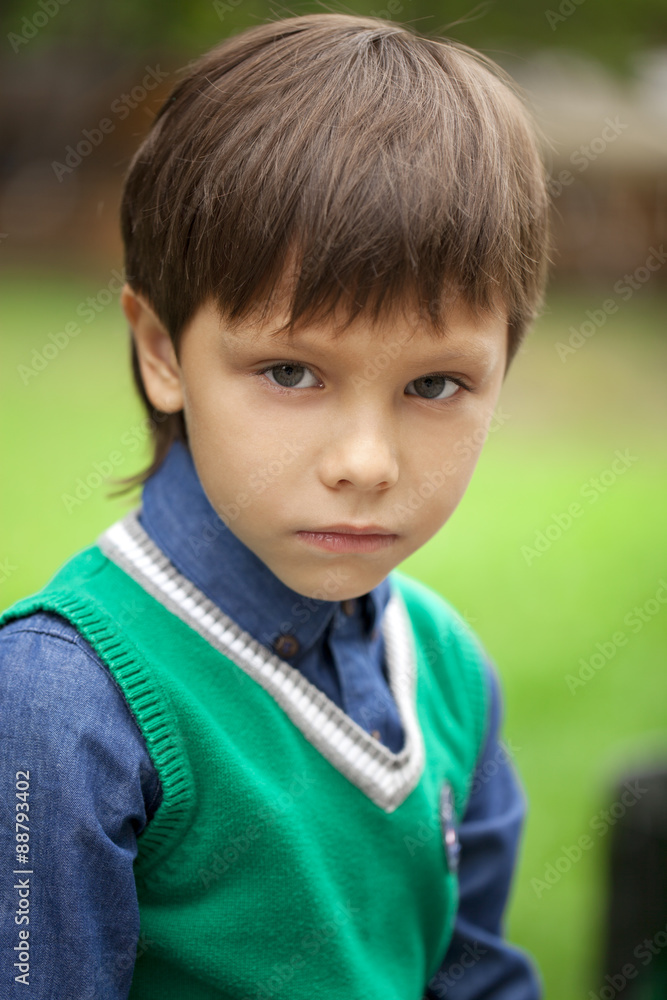 Fashionable little boy outdoor at the nice summer day Fashionable little boy outdoor at the nice summer day