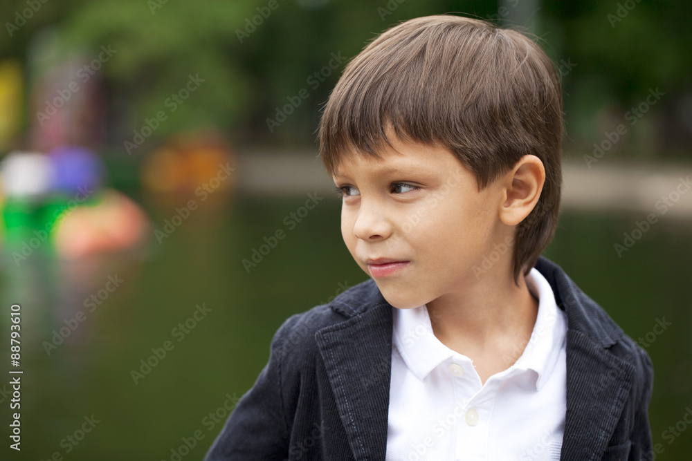 Fashionable little boy outdoor at the nice summer day Fashionable little boy outdoor at the nice summer day