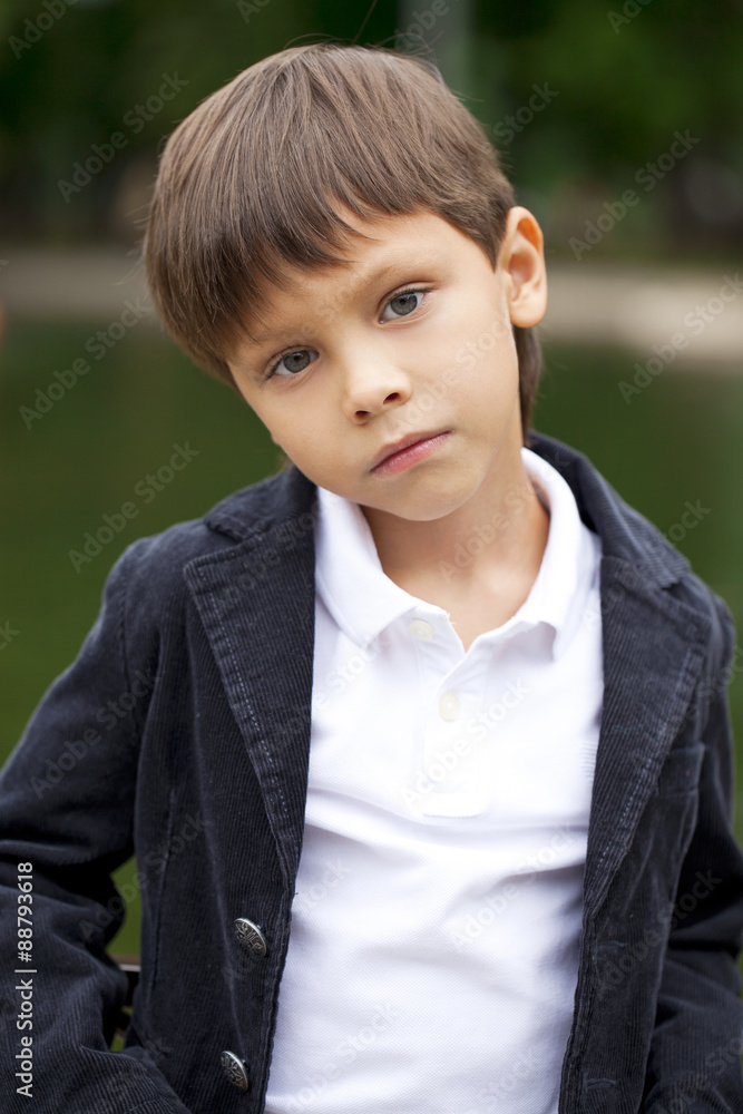 Fashionable little boy outdoor at the nice summer day Fashionable little boy outdoor at the nice summer day