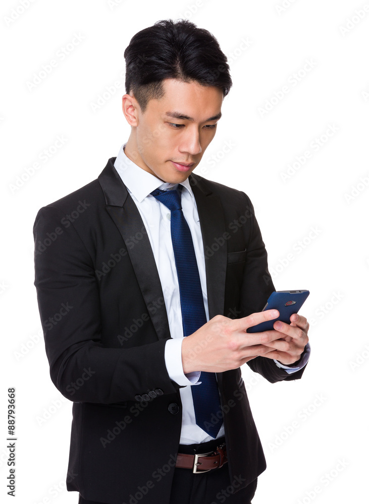 Young Businessman read the message on cellphone Young Businessman read the message on cellphone