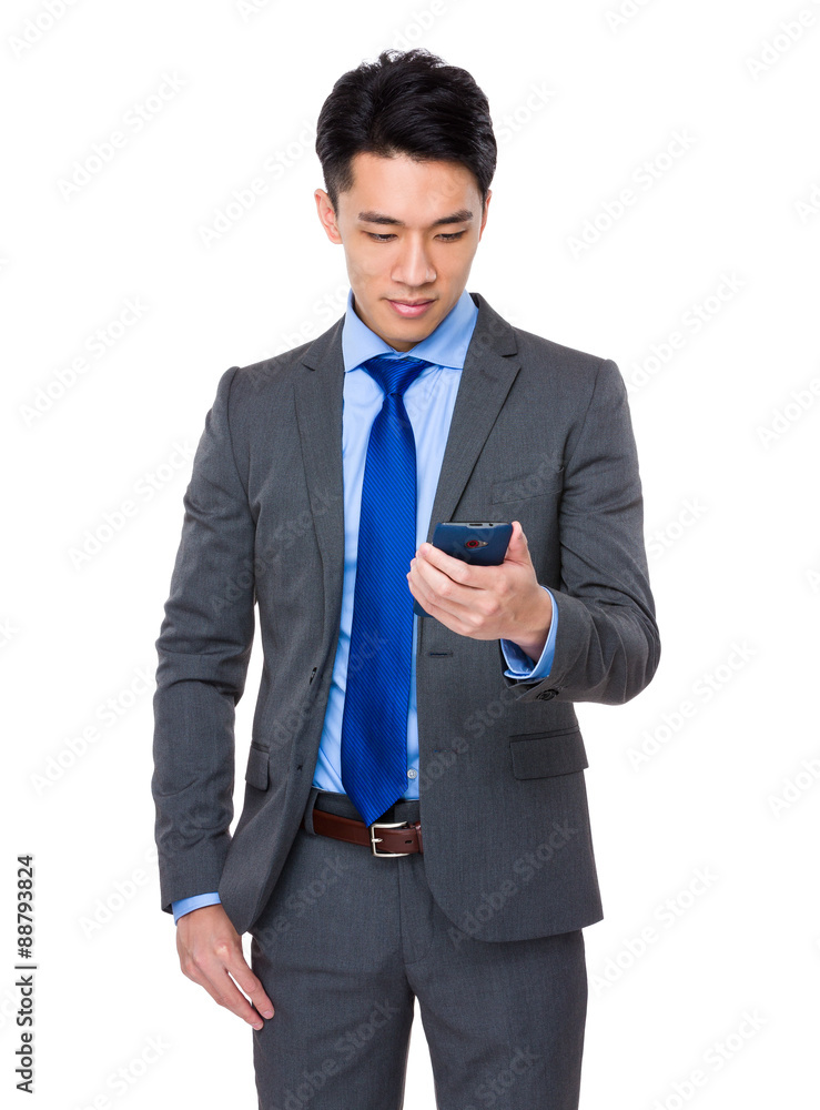 Young Businessman use of the cellphone Young Businessman use of the cellphone