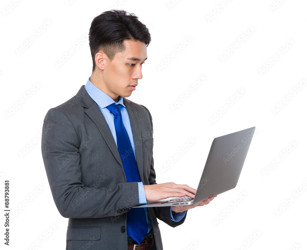 Asian Young Businessman use of the laptop computer Asian Young Businessman use of the laptop computer