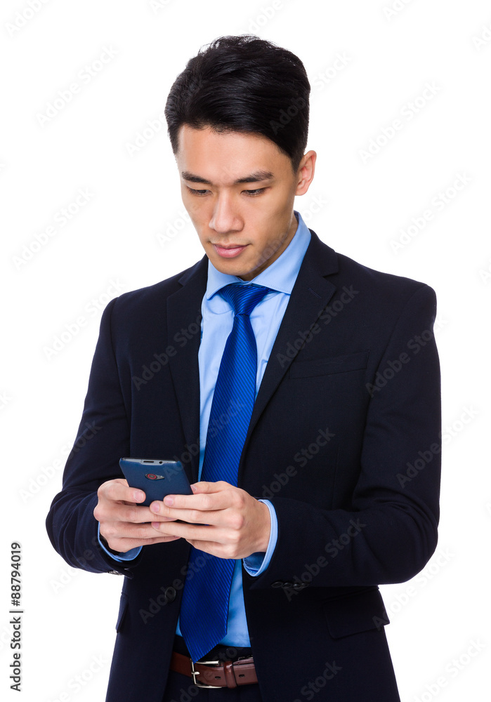 Asian young businessman use of the tablet pc Asian young businessman use of the tablet pc