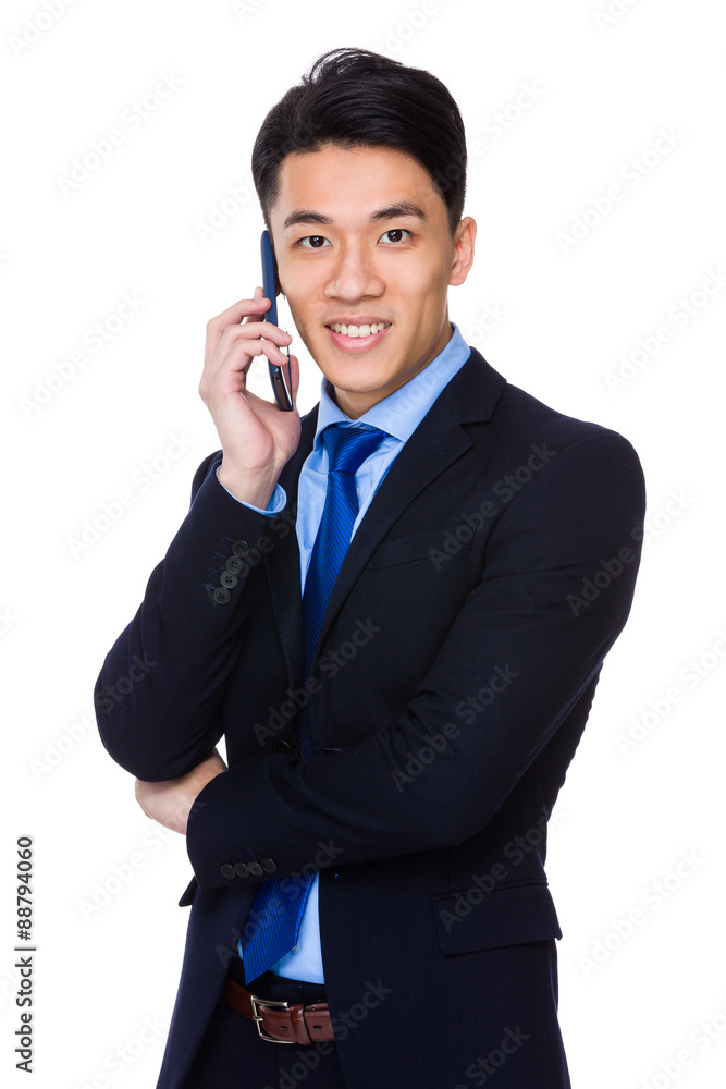 Asian businessman talk to mobile phone Asian businessman talk to mobile phone