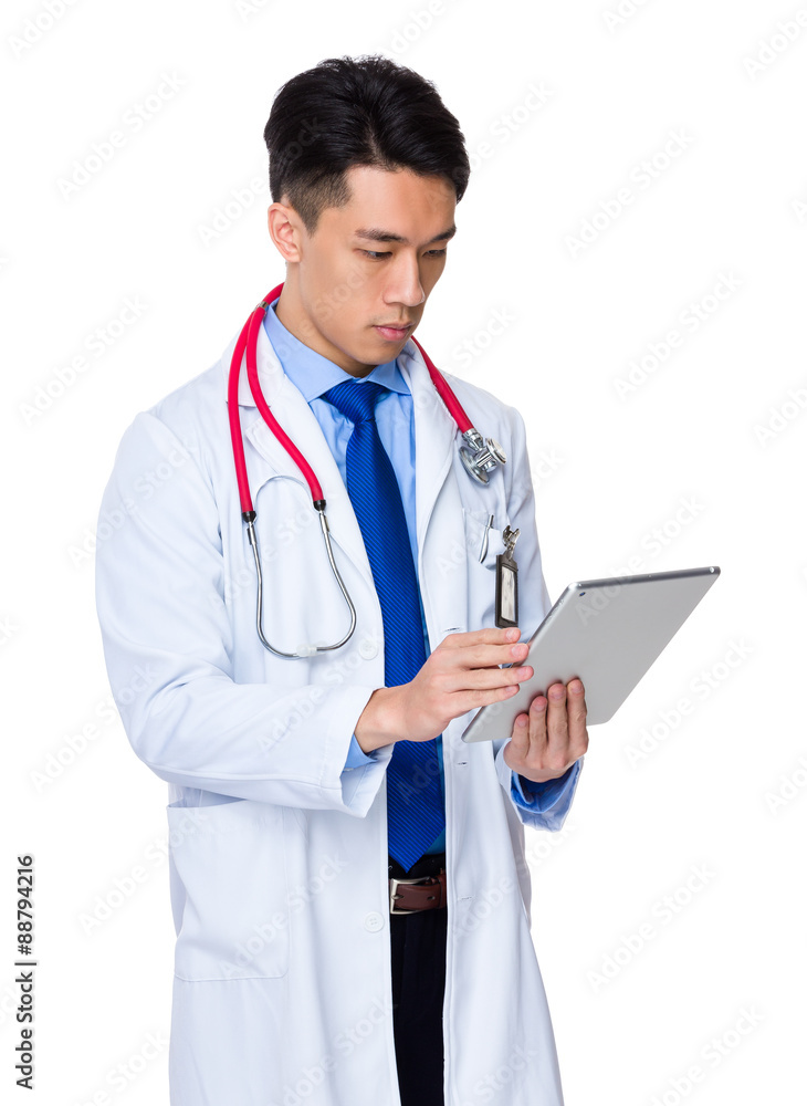 Male Doctor use of the digital tablet Male Doctor use of the digital tablet