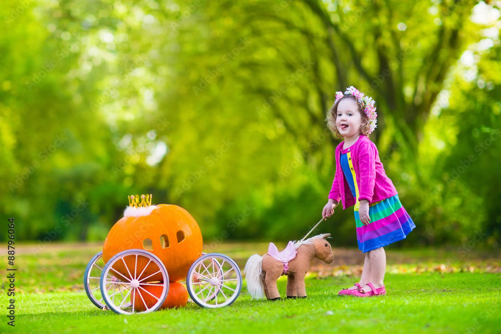 Little girl at pumpkin patch at Halloween Stock Photo | Adobe Stock