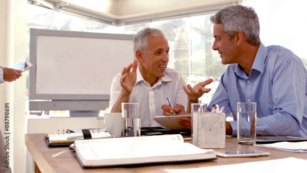 Casual Businessman giving a speech during a meeting Casual Businessman giving a speech during a meeting