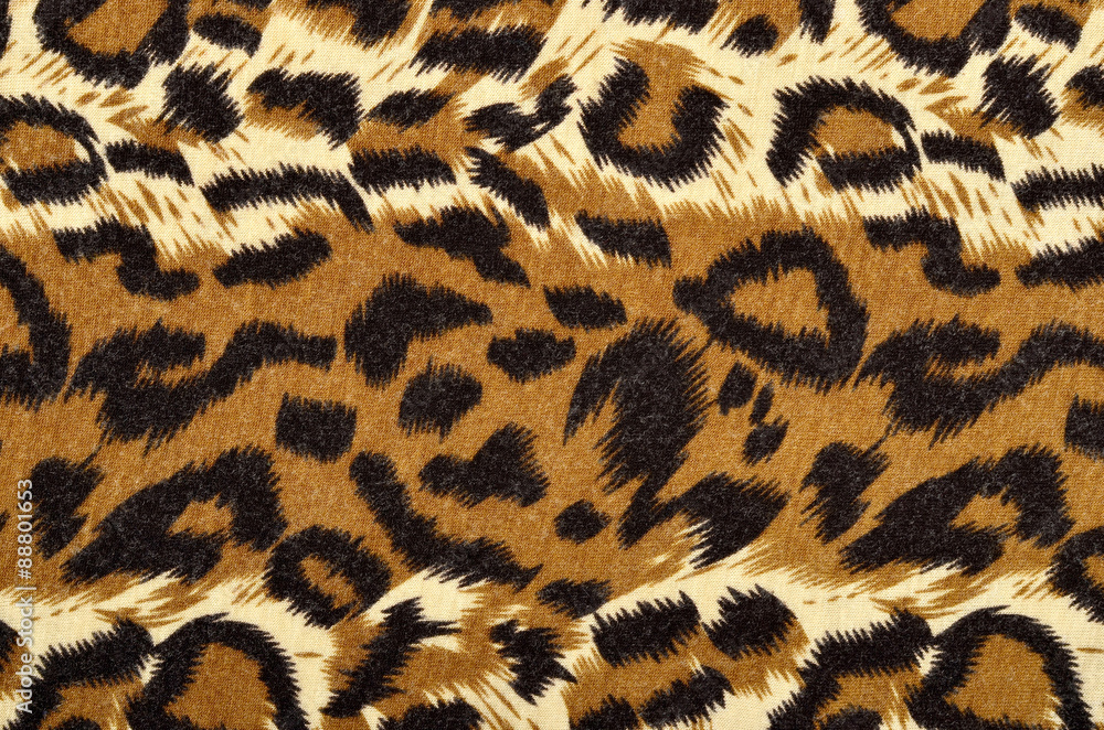 Brown leopard fur pattern. Spotted animal print as background. Brown leopard fur pattern. Spotted animal print as background.