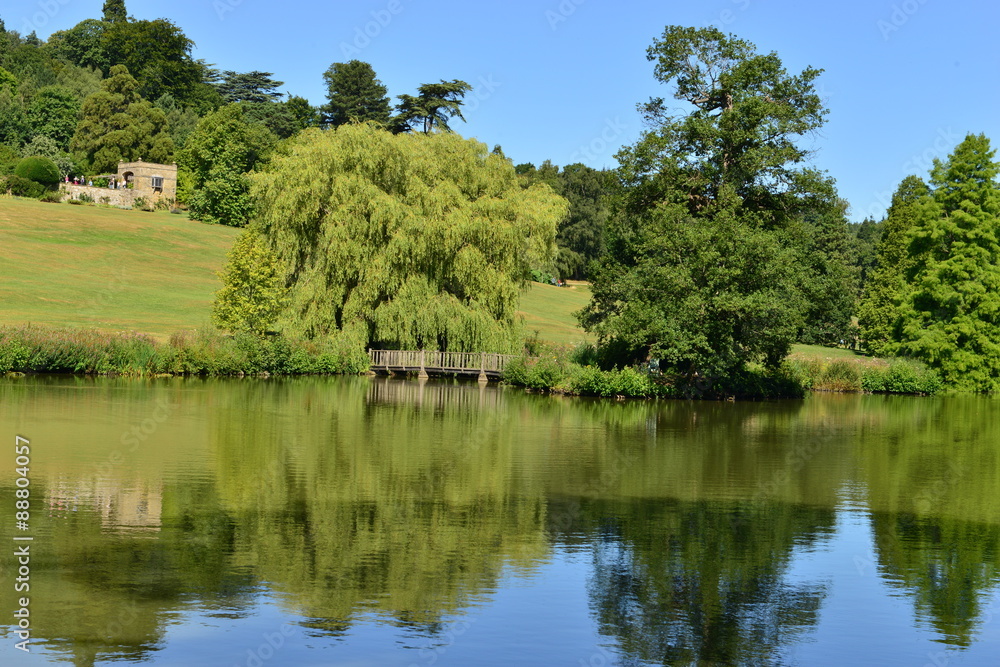 A lake at an English country estate in August,