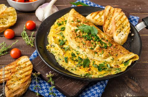 Herb omelette with chives and oregano sprinkled with Herb omelette with chili flakes photo