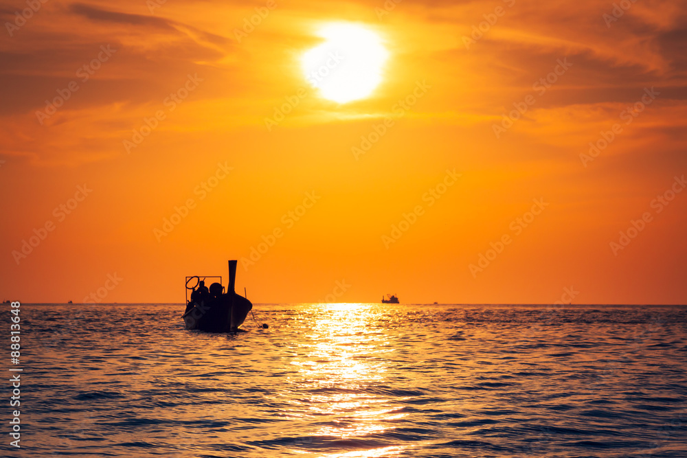 Fishing boat with sunset in phi phi islands,Thailand