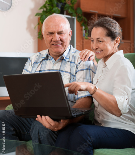 Mature couple  with notebook