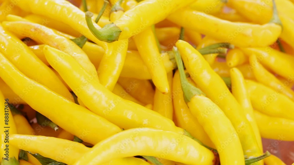 Yellow hot chili peppers at rotating stand; no people, close up; HD 1080 static; Yellow hot chili peppers at rotating stand; no people, close up; HD 1080 static;