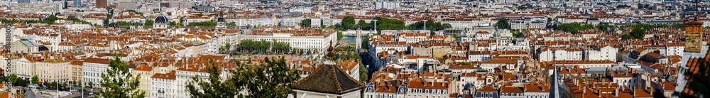 Panoramic overview to Lyon city, orange roofs and new buildings
