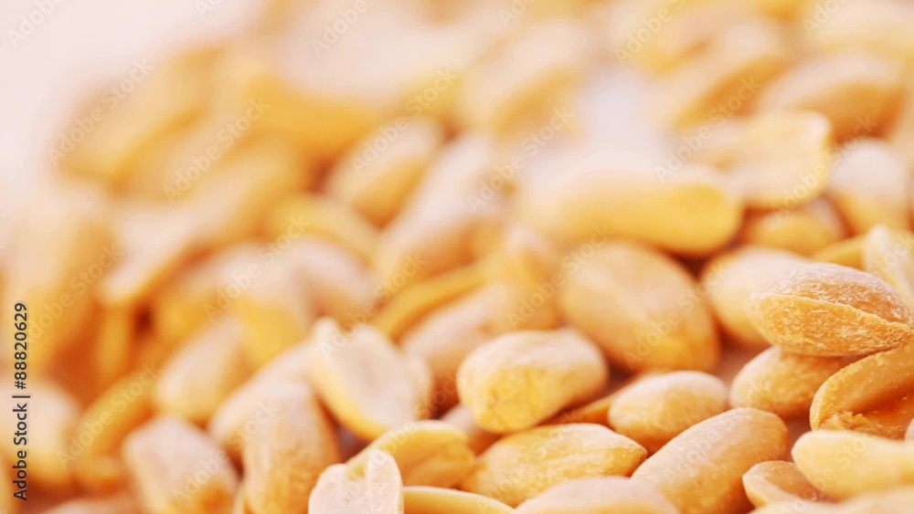 Roasted salty peanuts seed at rotating stand; close up; no people; HD 1080 Roasted salty peanuts seed at rotating stand; close up; no people; HD 1080