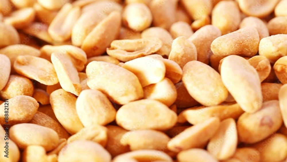 Roasted salty peanuts seed at rotating stand; close up; no people; HD 1080 Roasted salty peanuts seed at rotating stand; close up; no people; HD 1080