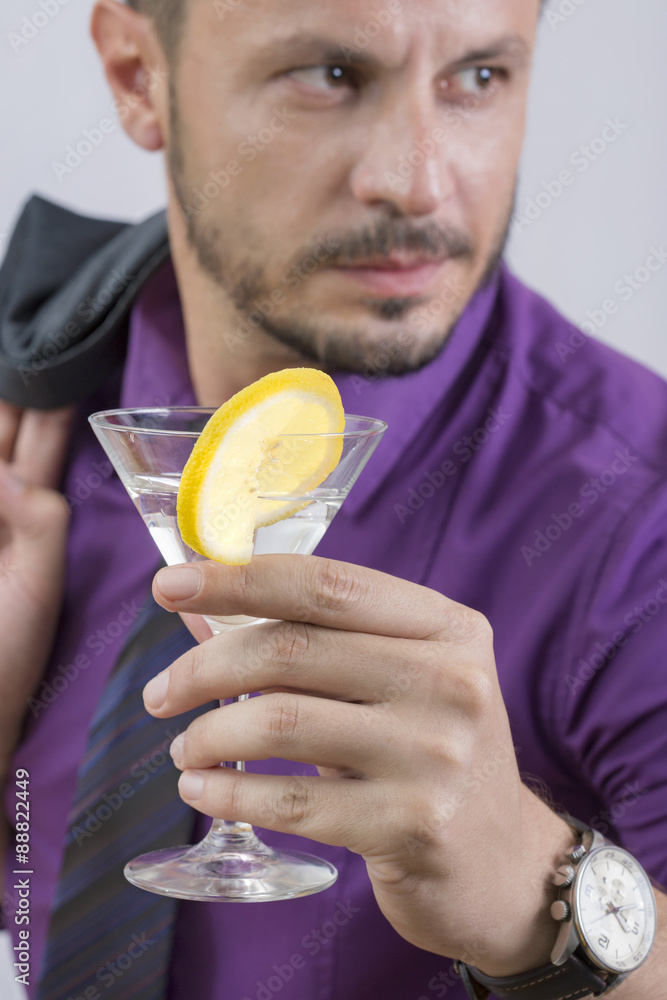 Gentleman holding a martini glass Gentleman holding a martini glass