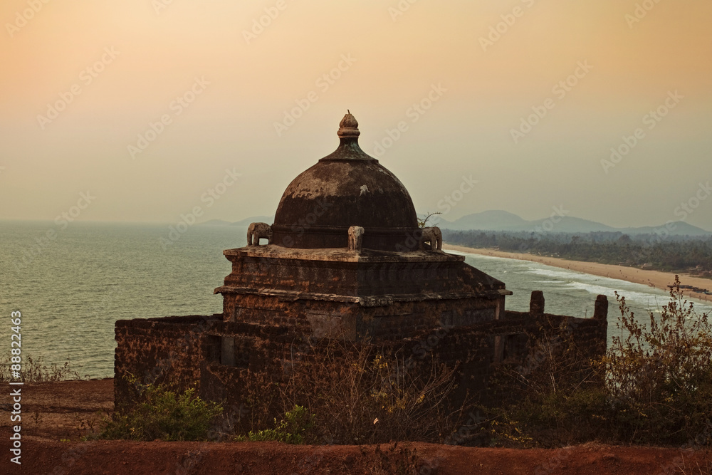 Small ancient Hindu temple by the sea