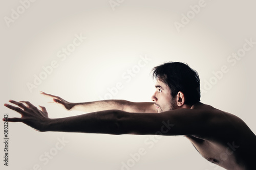 Naked young man on a white background