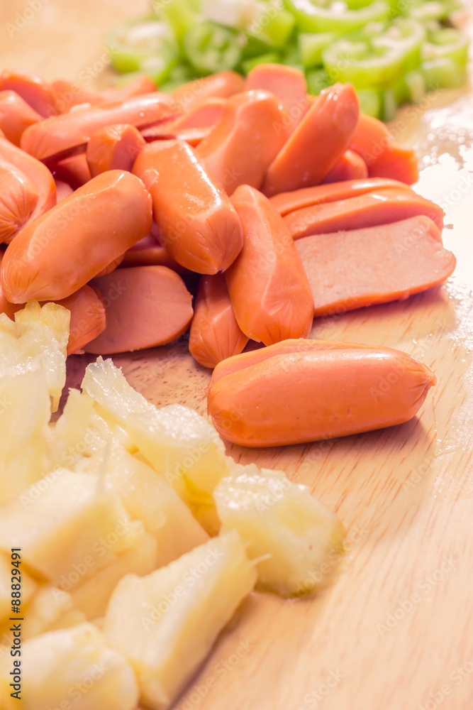 Preparing a stir fry of stewed vegetables and sausage Preparing a stir fry of stewed vegetables and sausage