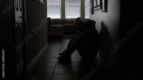 A soldier with PTSD starts crying in lonely hallway, WIDE, 4K photo