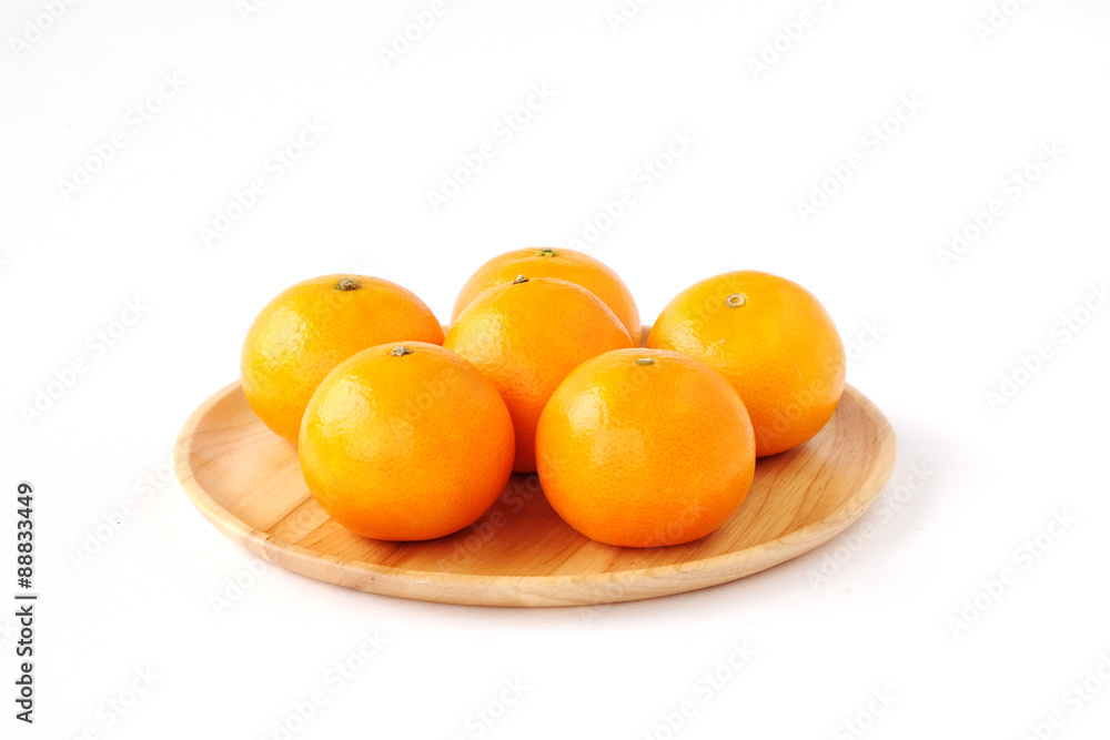 Oranges on wooden tray isolated on white backgound Oranges on wooden tray isolated on white backgound
