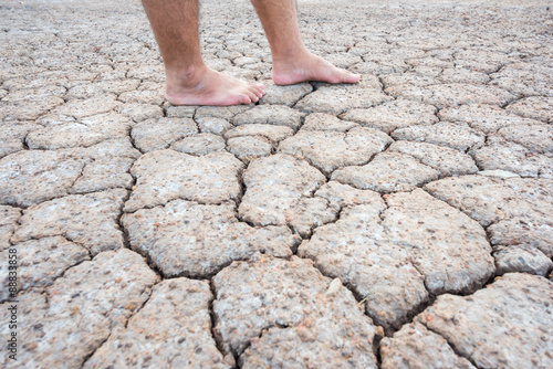 Foot on crack soil in dry season