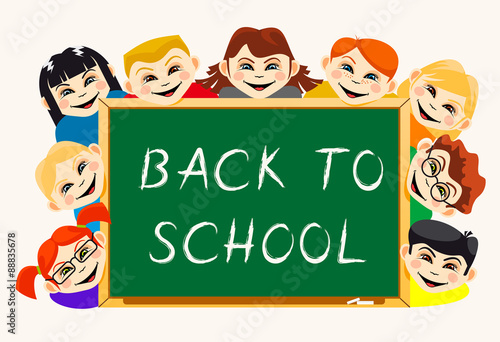 Happy boys and girls near school board