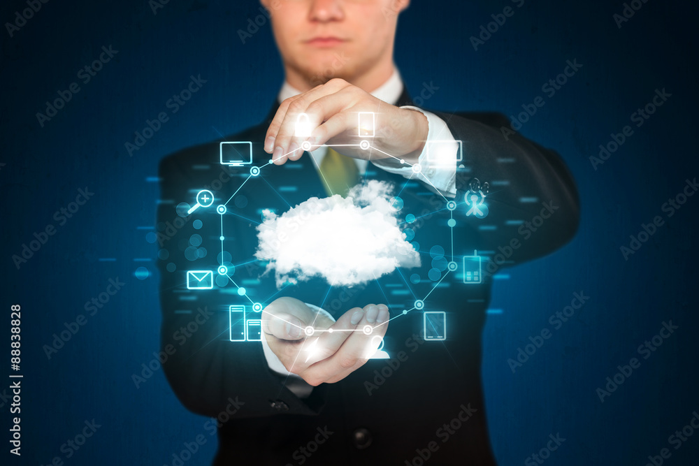 Businessman holding digital icons Businessman holding digital icons