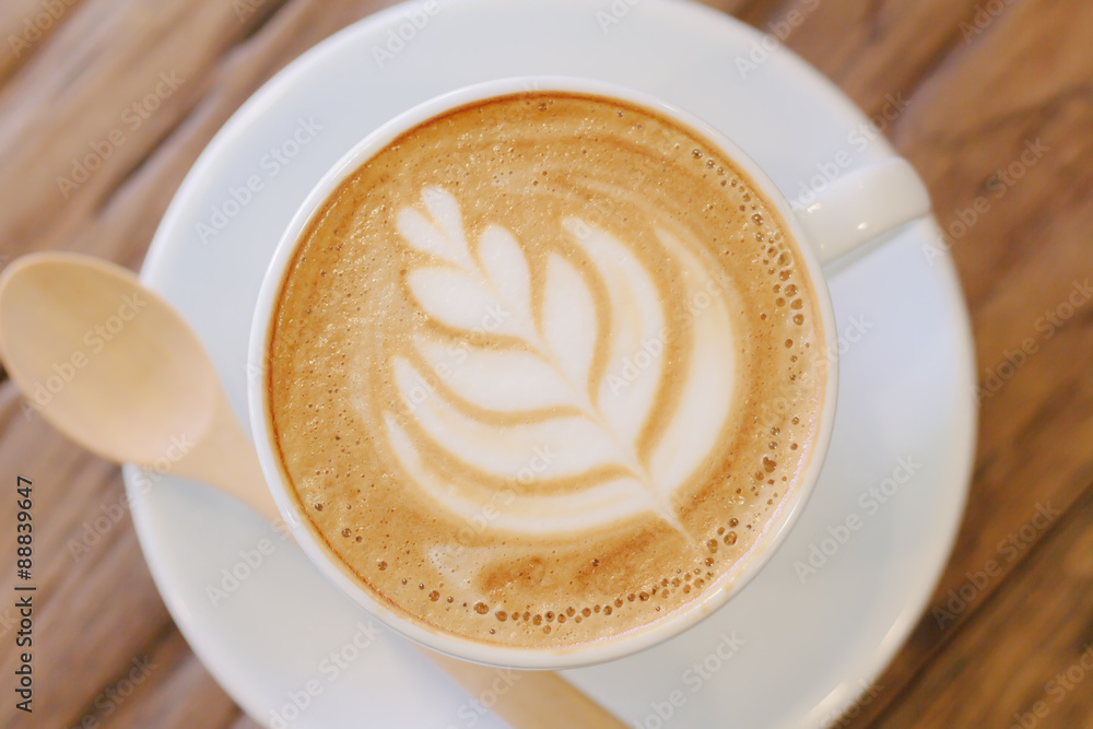 Cup of coffee latte art on wood table Cup of coffee latte art on wood table