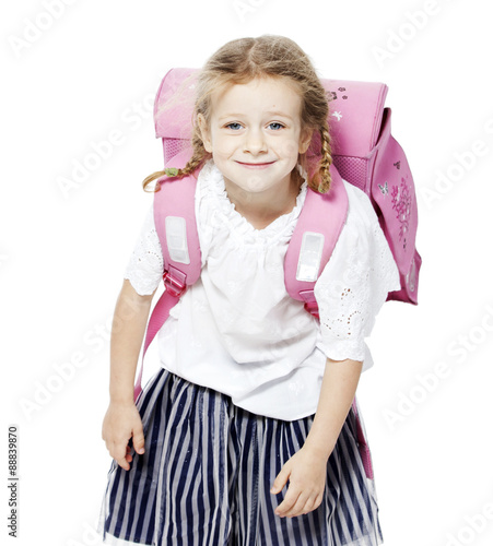 the little girl smiles . white background with pink backpack