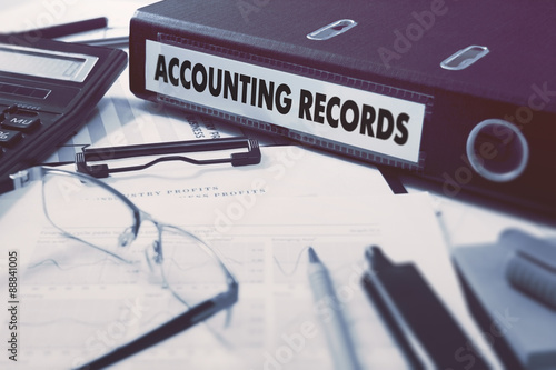 Accounting Records on Ring Binder. Blured, Toned Image.