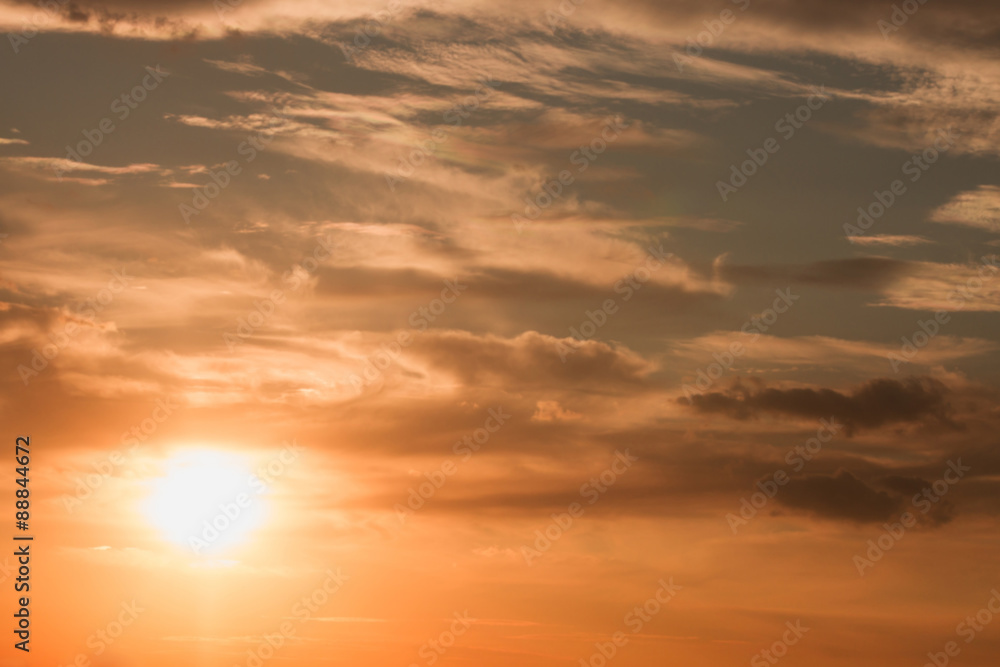 Sunset / sunrise with clouds, light rays and other atmospheric effect. Beautiful natural background.