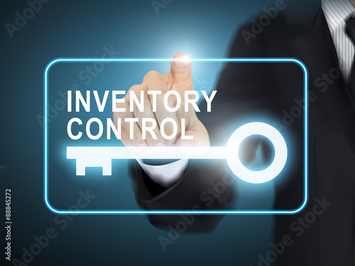 male hand pressing inventory control key button