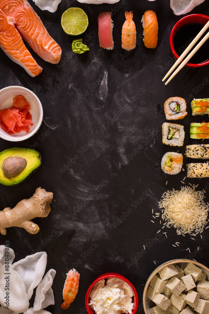 Sushi and ingredients on dark background Sushi and ingredients on dark background