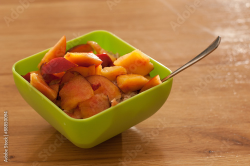 Bowl with porrige and fruits for breakfast photo