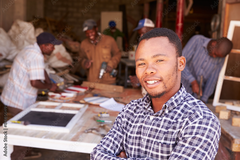 Portrait of man in a busy carpentry workshop, South Africa
