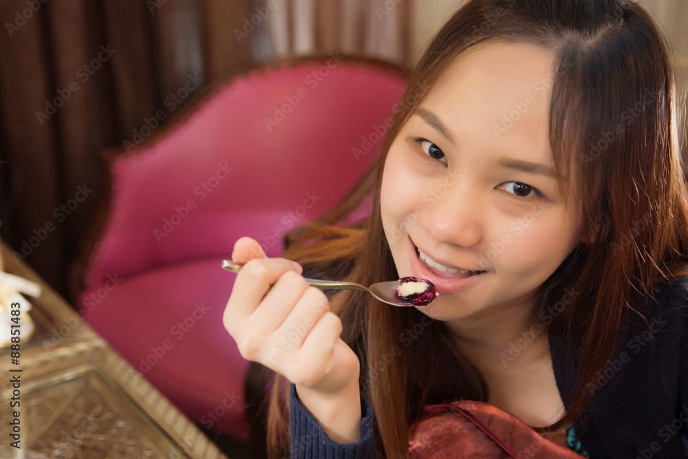 Beautiful girl smile and acting for prepare eating cake in coffe Beautiful girl smile and acting for prepare eating cake in coffe