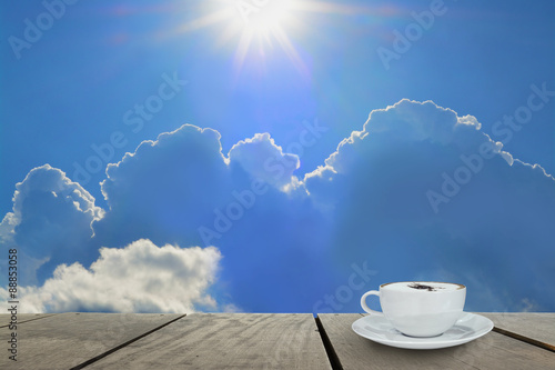 Beautiful cloud in morning time with coffee on terrace wood