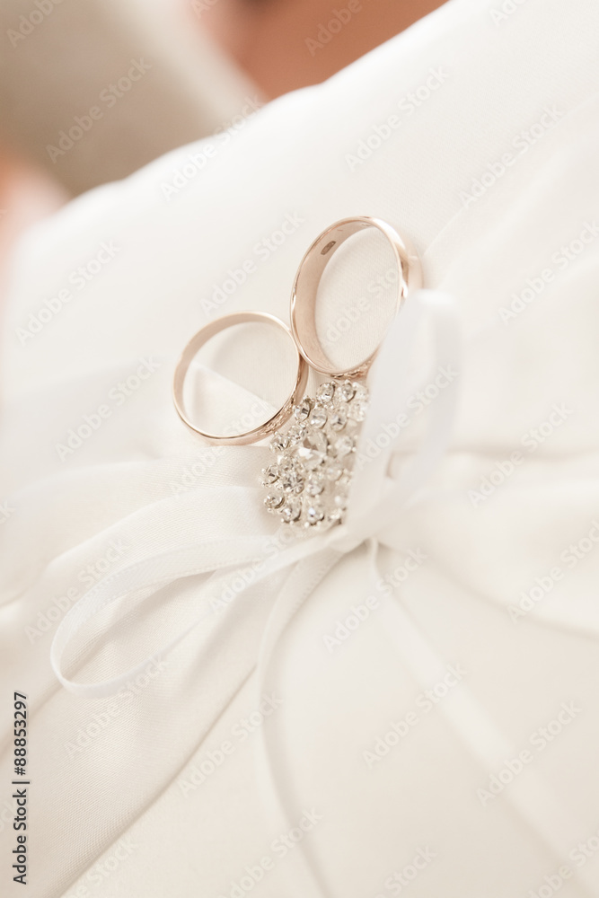 Gold wedding rings on a pillow. Gold wedding rings on a pillow.