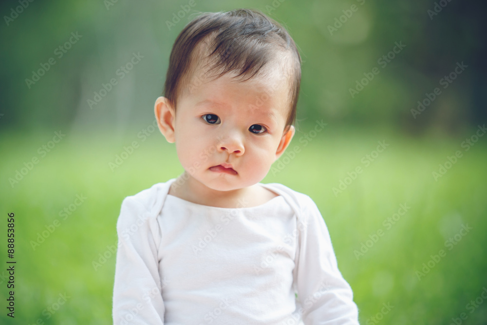 Asian child portrait in garden (soft focus on the eyes) Asian child portrait in garden (soft focus on the eyes)