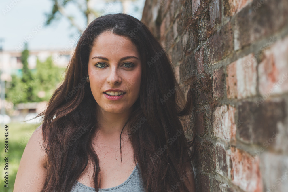 Beautiful curvy girl posing in an urban context Beautiful curvy girl posing in an urban context