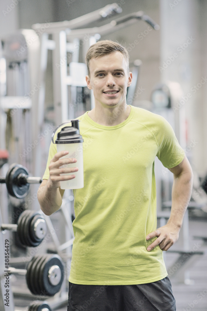 smiling man with protein shake bottle smiling man with protein shake bottle