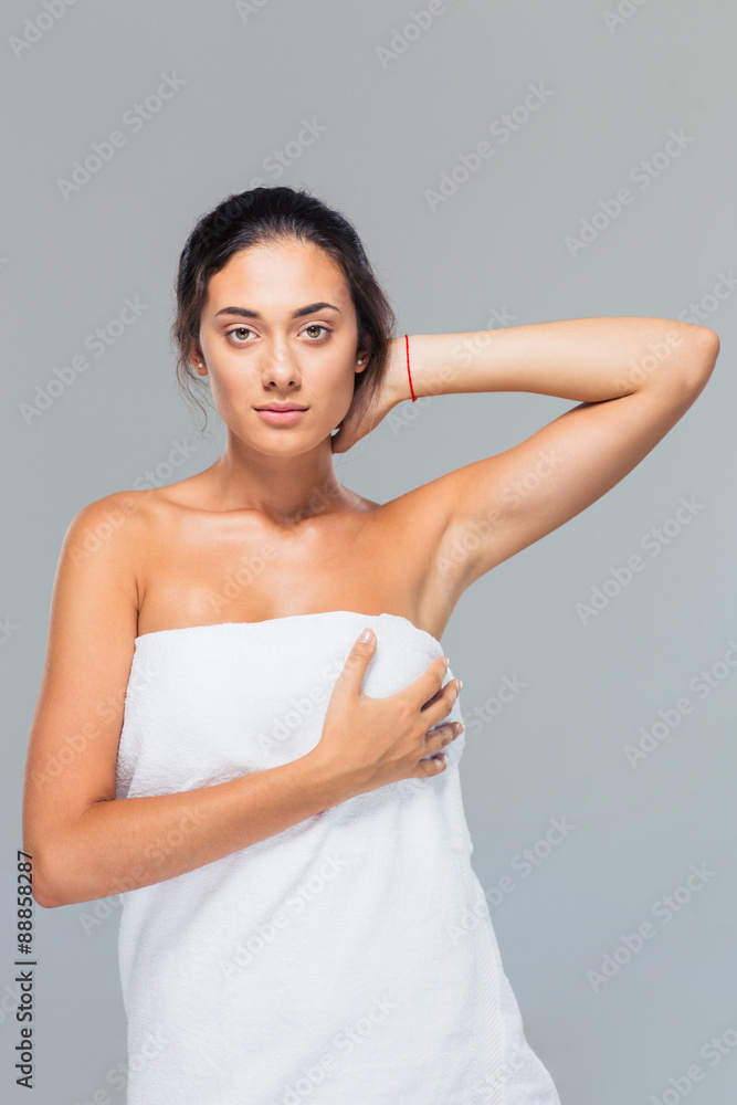 Portrait of a pretty woman standing in towel Portrait of a pretty woman standing in towel
