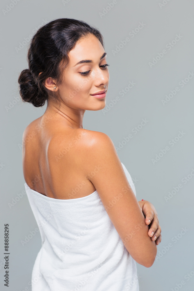 Portrait of attractive woman in towel looking away